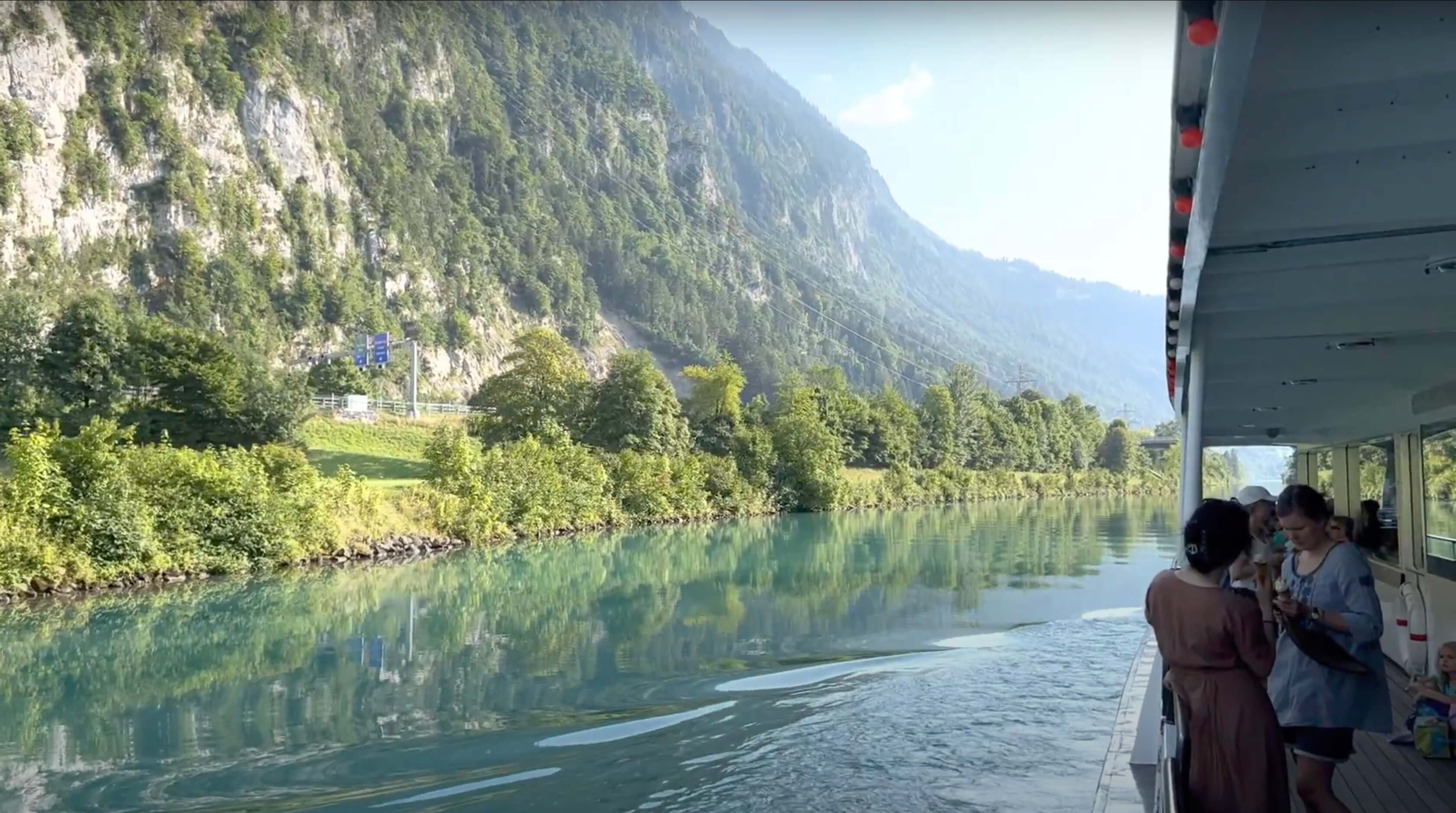 View from a boat on the lake looking at the mountains