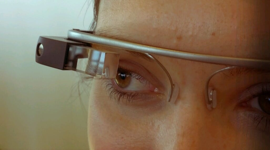 A person wearing Google Glass AR headset